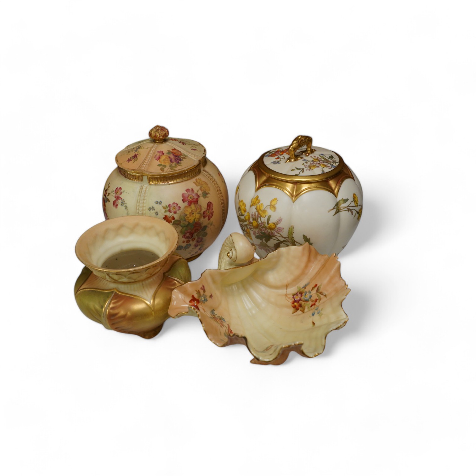 Two Worcester blush ivory biscuit jars and covers, numbers 1412 and 1796, a shell dish, number 971 and a vase, number 1877, tallest 17cm. Condition - mostly good, some wear to gilding